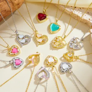 Detailed view of various heart-shaped pendant necklaces with shiny zircon and elegant chains.