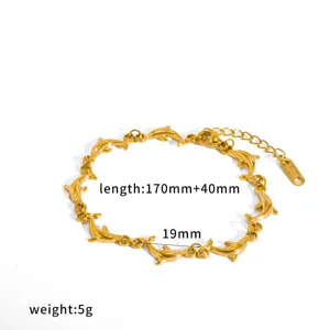 Bracciale a catena con delfini in acciaio inossidabile dorato, dettaglio marino.