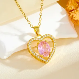 Elegant gold-plated heart pendant necklace featuring a sparkling pink oval cubic zirconia stone.