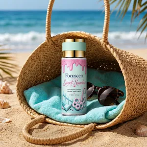 Detailed close-up of Focuscent Sweet Sundae fragrance mist in a summer beach setting
