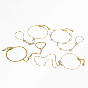 Gold stainless steel rhinestone hand chain set, delicate finger bracelet detail display.