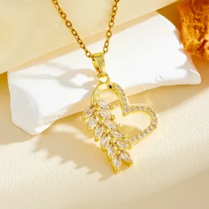 Gold tone heart leaf zirconia pendant necklace close up view detail shot elegant