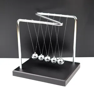 Detailed view of the metal Newton's cradle balance balls desk toy for office and home decor.