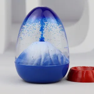 Creative liquid volcano eruption ornament detail view, blue glitter motion desk toy gift.