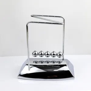 Metal Newton cradle balance balls physics toy office desk decor closeup silver finish