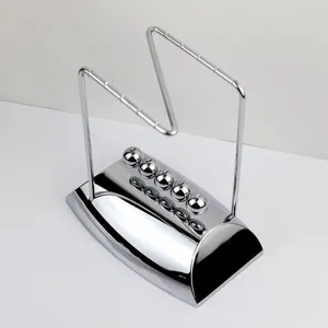 Metal Newton cradle balance balls desk toy, shiny chrome finish physics science pendulum decor.