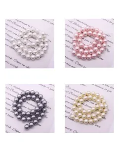 Detailed view of colorful faux pearl round glass bead strands for DIY jewelry making and crafting.