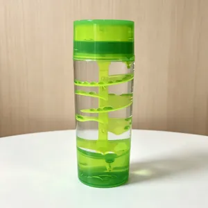 Green liquid motion bubbler sensory toy with spiral staircase design for desktop decoration