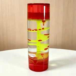 Detail shot of the creative liquid motion bubbler toy with a vibrant red and yellow spiral design.