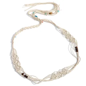 Bohemian woven waist belt with delicate knots and wooden beads, perfect for dresses.