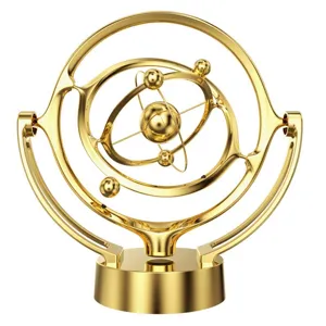 Gold kinetic desk toy celestial orbit gyroscope perpetual motion office decoration detail view.