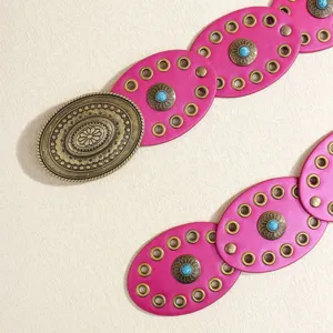 Bohemian pink turquoise round piece belt detail view, vintage brass buckle decorative waist belt.