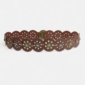 Close-up detail of western retro turquoise round disc spliced women fashion waist belt