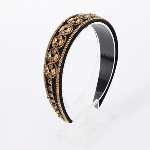 Exquisite baroque style rhinestone headband detail showcasing sparkling amber crystals and beads.