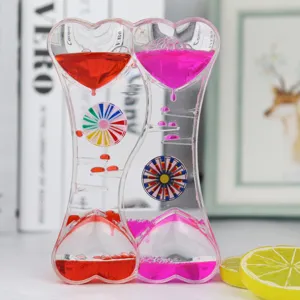 Creative double heart liquid motion bubbler toy with colorful oil drops and spinning wheels.