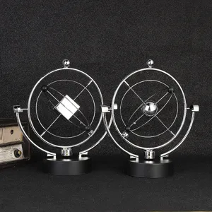 Giocattolo di bilanciamento d'arte cinetica in metallo scultura orbitale ufficio.