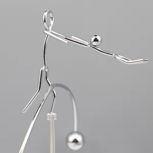 Metal balans speelgoed bureau ornament fysica zwaartekracht vliegende man decoratie