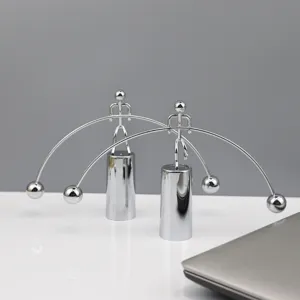 Metal balancing man toy for desk decor, stress relief physics toy, creative gift detail view.