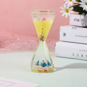 Diamond liquid oil hourglass timer ornament with blue fish and glitter for room decor gift.