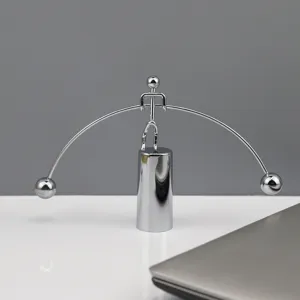 Creative metal balance toy kinetic art iron man desk ornament, exquisite detail view.