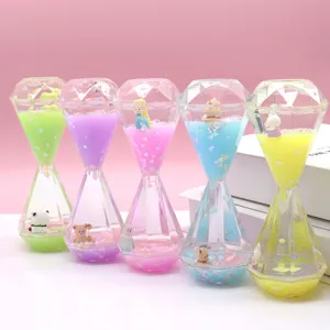 Colorful liquid diamond hourglass oil drop timer toy with cute animal figurines for desk decor.