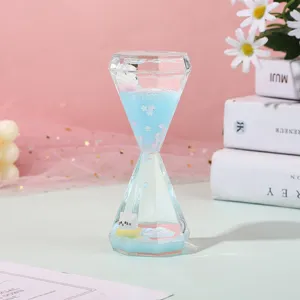 Diamond liquid hourglass oil timer sensory toy with cute cat figurine for desktop decor.