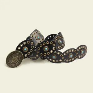 Detailed view of women bohemian black leather belt with turquoise stones and brass metal buckle.