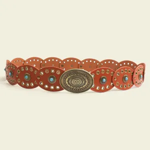 Close-up detail of the vintage boho women belt, featuring turquoise stones and carved metal buckle.