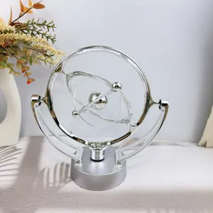 Silver kinetic art celestial globe desk toy, modern metal orbital sculpture home decor.