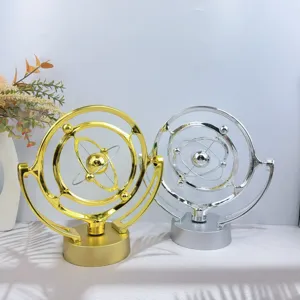 Creative desktop kinetic art ornament, celestial perpetual motion metal toy for office decor.