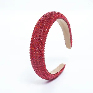 Red rhinestone headband detail view, sparkling crystals, handmade hair accessory style.