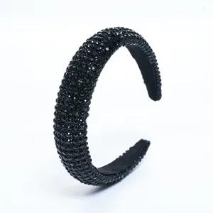 Detailed close-up view of the elegant black rhinestone full-wrap headband accessory.