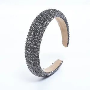 Detailed view of the dark grey rhinestone headband, sparkling crystal luxury hair accessory.