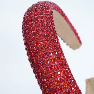 Close-up detail shot of a sparkling red rhinestone full-wrap headband, luxury hair accessory.