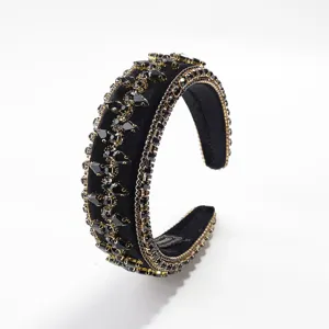 Close-up of black velvet rhinestone headband detail, showing exquisite crystal and trim.
