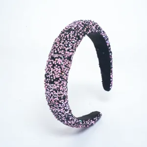 Charming pink star glitter headband detail, sparkling sequin hair accessory for sweet styling.