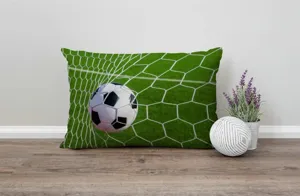Detail view of soccer pillowcase featuring football in net print, perfect for sofa decor.