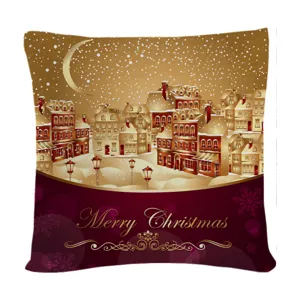 Festive Christmas cushion cover featuring snowy village design and gold holiday text.