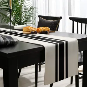 Zwart-wit gestreepte tafelloper modern minimalistisch linnen tafelkleed voor huisdecoratie.