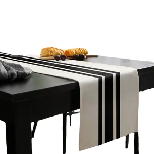 Moderne zwart-witte geometrisch gestreepte linnen tafelloper voor eettafel decoratie.