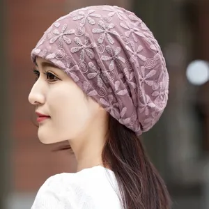 Lace chemo cap detail view, breathable hollow floral design for women, elegant daily wear hat.