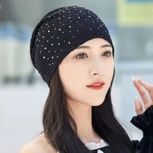 Close-up detail of black lace rhinestone slouchy cap, breathable summer headscarf style.