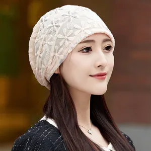 Closeup of women's breathable lace cap, lightweight floral mesh design, soft comfortable fit.