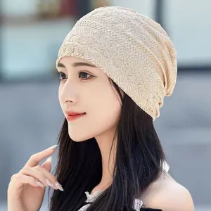 Detail shot of breathable lace rhinestone beanie hat, elegant casual headscarf design.