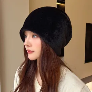 Fluffy winter warm plush hat for women, detailed side view showing soft black fabric texture.