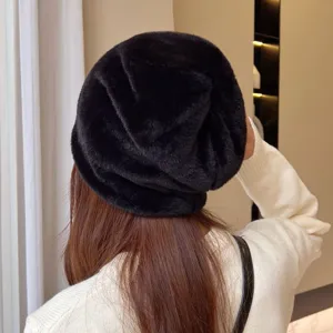 Detailed view of the black plush slouchy beanie, showing soft texture and cozy fit.