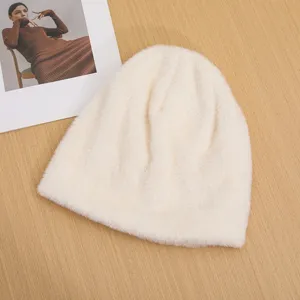 Fluffy warm winter knit beanie hat for women, soft plush windproof cap for outdoor daily wear.