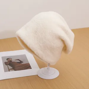 Fuzzy plush winter warm hat for women, soft slouchy beanie and cozy outdoor windproof cap.