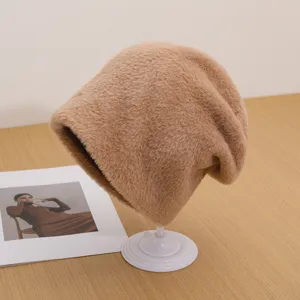 Fluffy winter warm knitted hat for women, soft thick slouchy cap for outdoor cold weather.