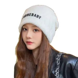 Winter warm fluffy beanie hat for women, thick plush knit windproof cold weather cap.